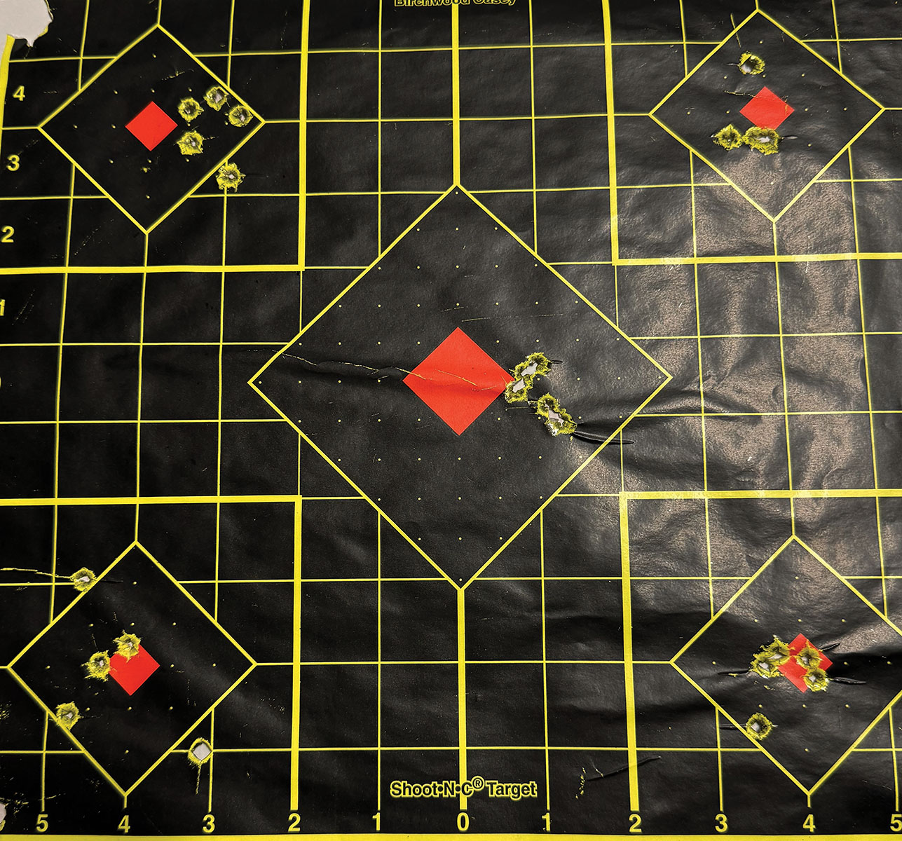 Target center is an 85-grain Winchester Ballistic Silvertip, top left is a 117-grain Hornady Superformance SST, top right is a 110-grain Hornady Precision Hunter ELD-X, bottom left is a 100-grain Remington Core-Lokt, and the bottom right is a 117-grain Hornady American Whitetail InterLock.